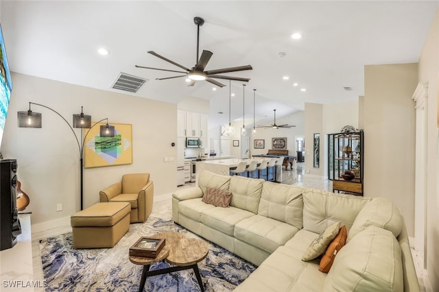 living room featuring vaulted ceiling and ceiling fan