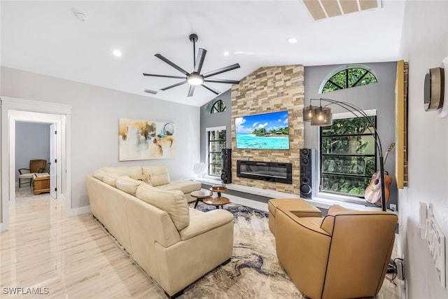 living room with a fireplace, lofted ceiling, ceiling fan, and light hardwood / wood-style flooring