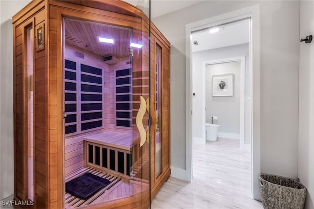 view of sauna with wooden ceiling