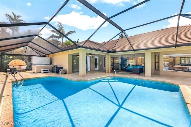 view of swimming pool featuring an outdoor living space, a lanai, ceiling fan, and a patio area