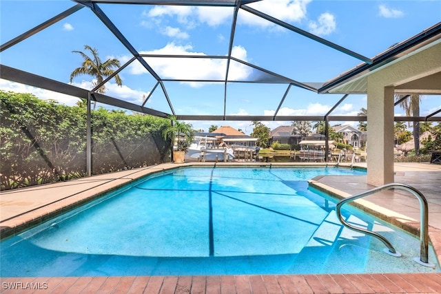 view of pool with a lanai