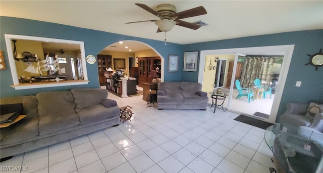 living room featuring ceiling fan and light tile patterned flooring