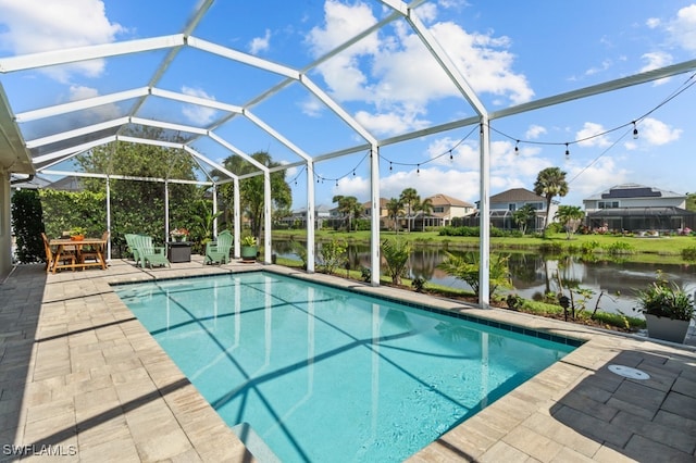 view of pool featuring a water view, a lanai, and a patio