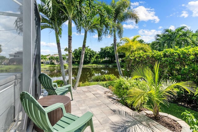 view of patio with a water view