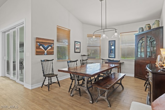 dining room with a chandelier and light hardwood / wood-style floors