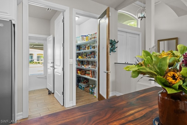 foyer featuring light hardwood / wood-style flooring and a notable chandelier