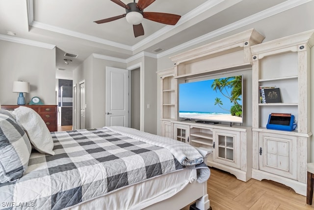 bedroom with crown molding, ceiling fan, a raised ceiling, and light parquet flooring