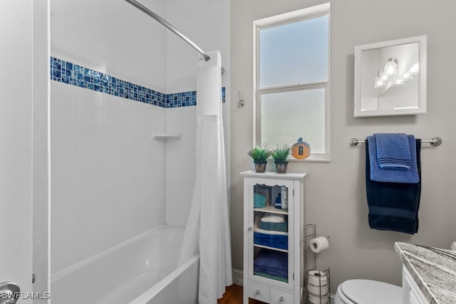 full bathroom featuring vanity, toilet, and shower / bath combination with curtain