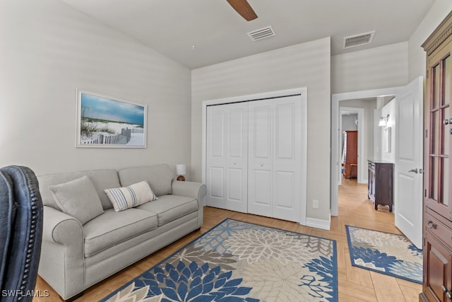 living room with ceiling fan and light hardwood / wood-style floors