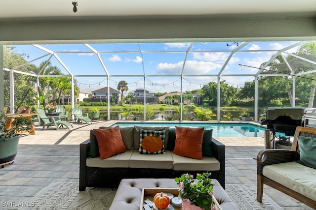 view of swimming pool with outdoor lounge area, glass enclosure, a grill, and a patio