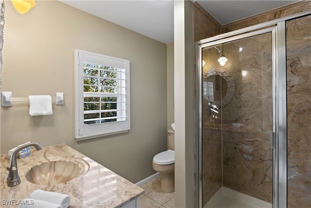 bathroom featuring tile patterned floors, vanity, toilet, and walk in shower