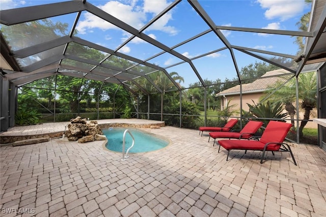 view of swimming pool featuring a lanai and a patio