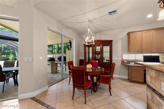 dining area with light tile patterned floors