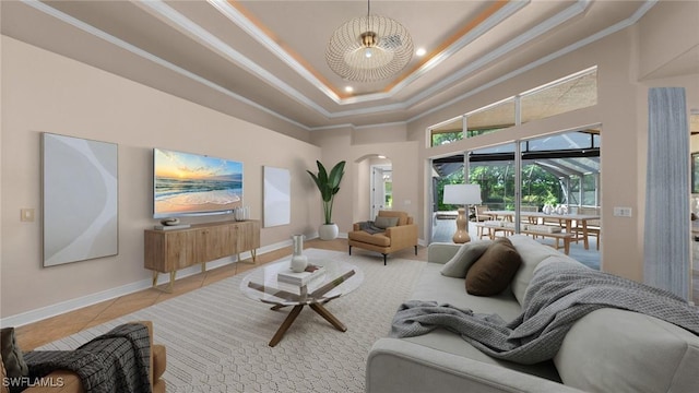 tiled living room featuring crown molding, a high ceiling, and a tray ceiling