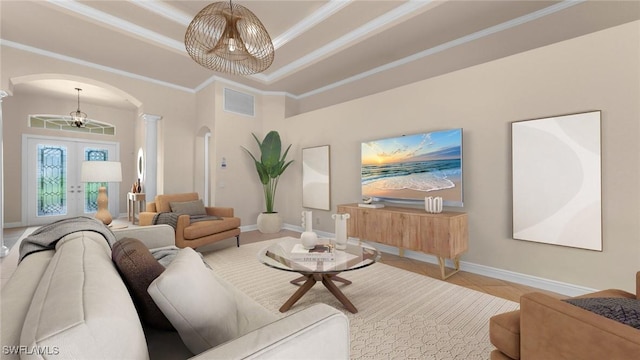 living room featuring french doors, crown molding, tile patterned flooring, a tray ceiling, and a chandelier