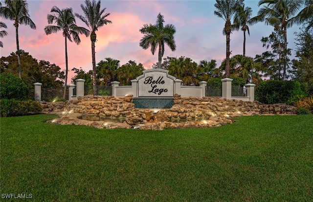 community / neighborhood sign with a lawn