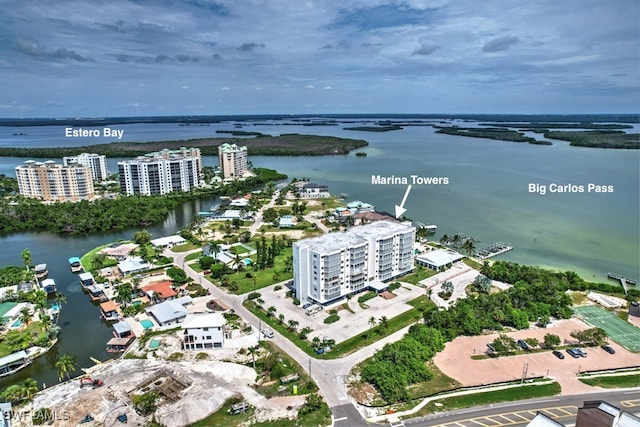 birds eye view of property with a water view