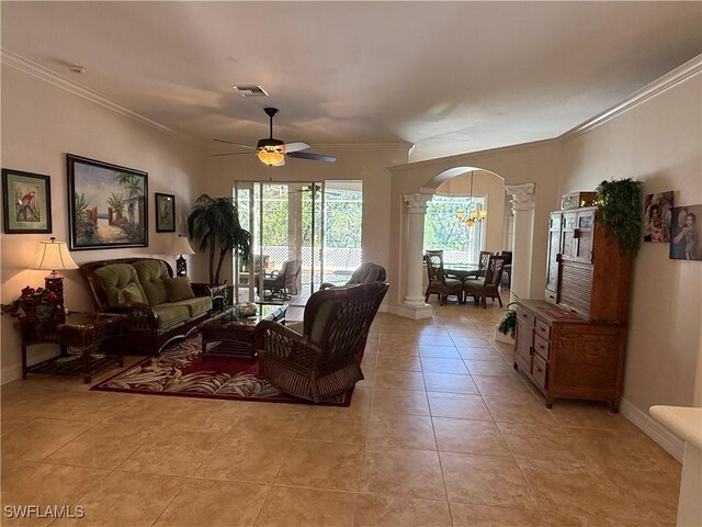 tiled living room featuring ceiling fan and ornamental molding