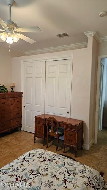 home office with ceiling fan and ornamental molding