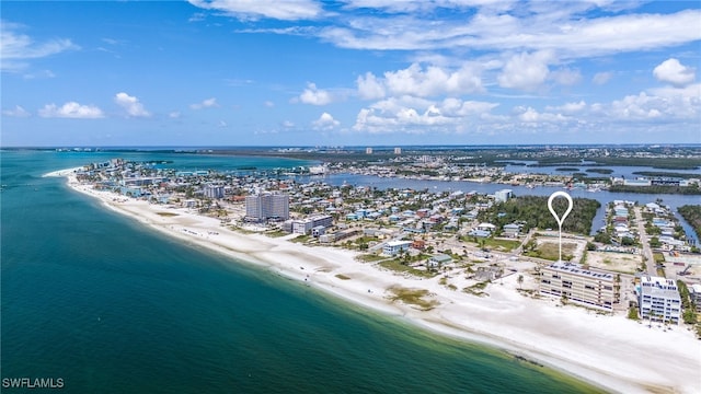 drone / aerial view featuring a water view and a view of the beach