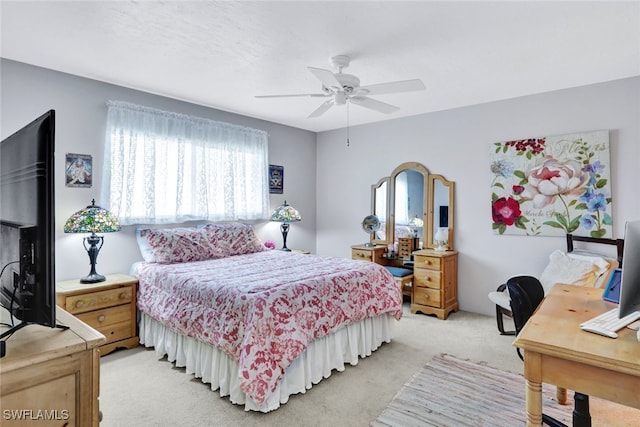 bedroom with ceiling fan and light colored carpet