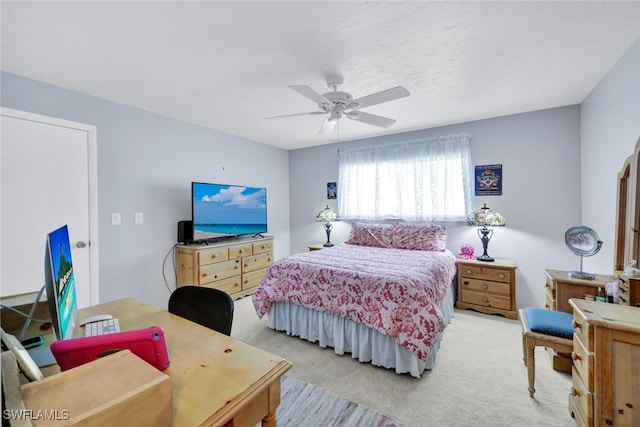 bedroom featuring ceiling fan and light colored carpet