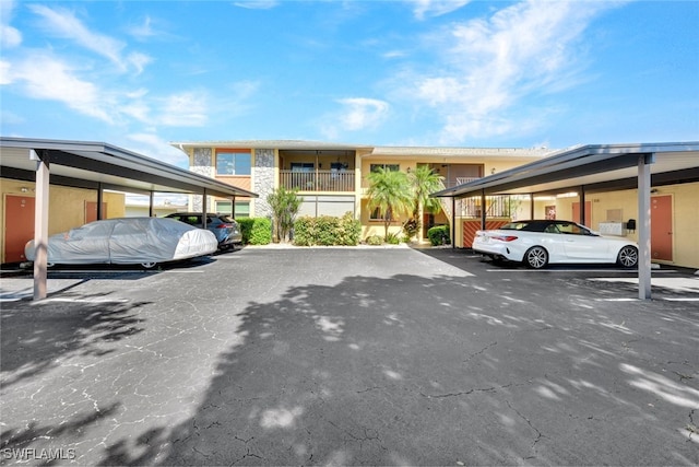 view of vehicle parking with a carport