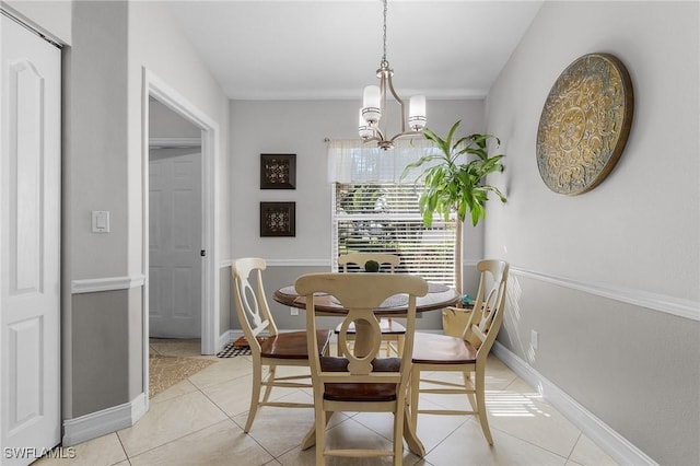 dining space featuring a notable chandelier and light tile patterned flooring