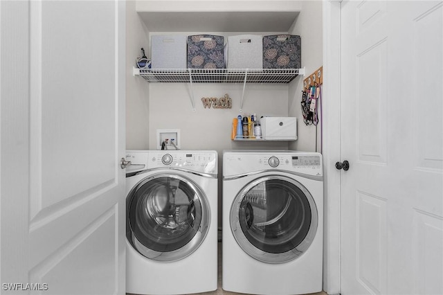 laundry area with washing machine and clothes dryer