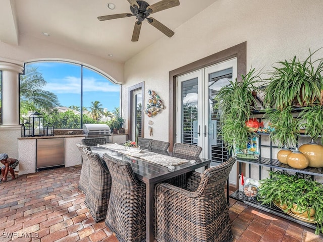 view of patio with grilling area, area for grilling, ceiling fan, and french doors