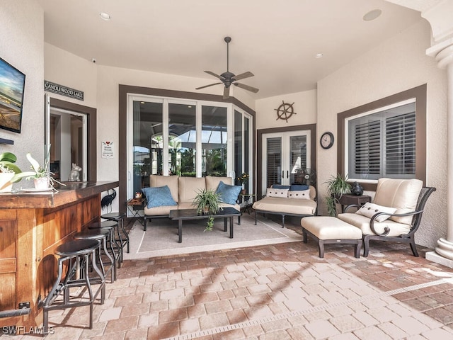 view of patio / terrace featuring ceiling fan, an outdoor hangout area, and an outdoor bar