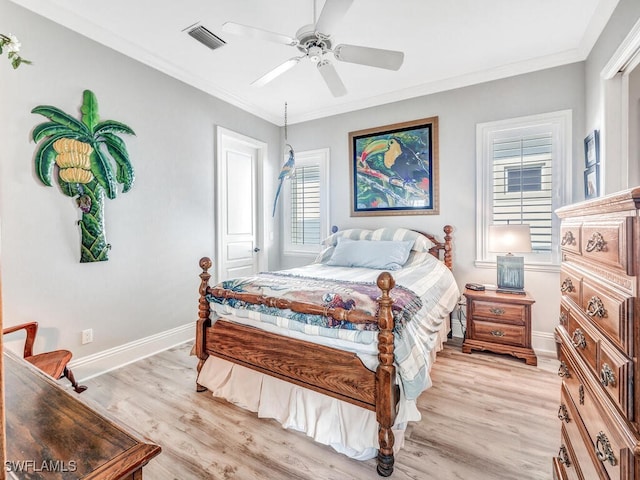 bedroom with ceiling fan, ornamental molding, and light hardwood / wood-style floors