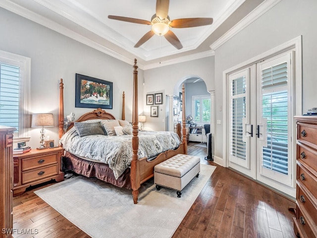 bedroom featuring light hardwood / wood-style floors, a raised ceiling, access to exterior, ceiling fan, and french doors