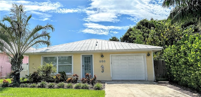 ranch-style house featuring a garage