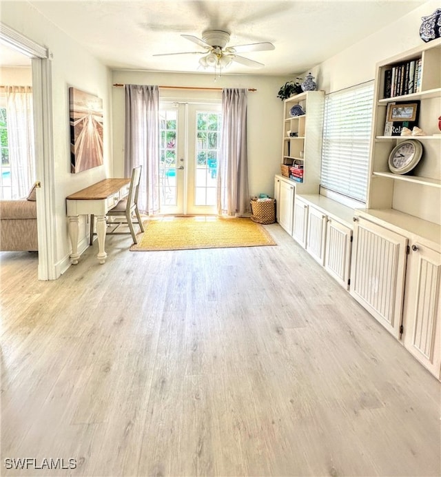 miscellaneous room featuring ceiling fan, light hardwood / wood-style flooring, and french doors