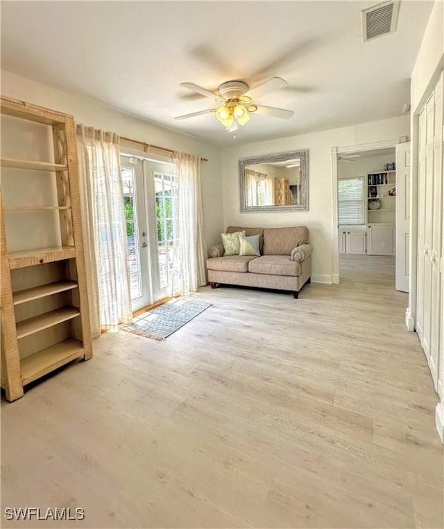 856 98th Ave N, Naples, FL 34108 - living area with wood finished floors and a ceiling fan