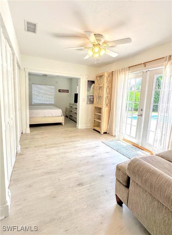 856 98th Ave N, Naples, FL 34108 - bedroom featuring access to outside, light wood finished floors, and ceiling fan