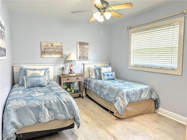 856 98th Ave N, Naples, FL 34108 - bedroom with wood finished floors and a ceiling fan