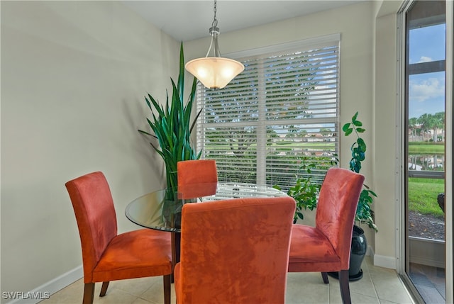 dining space featuring light tile patterned flooring