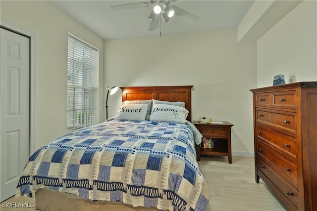 bedroom featuring light hardwood / wood-style floors and ceiling fan