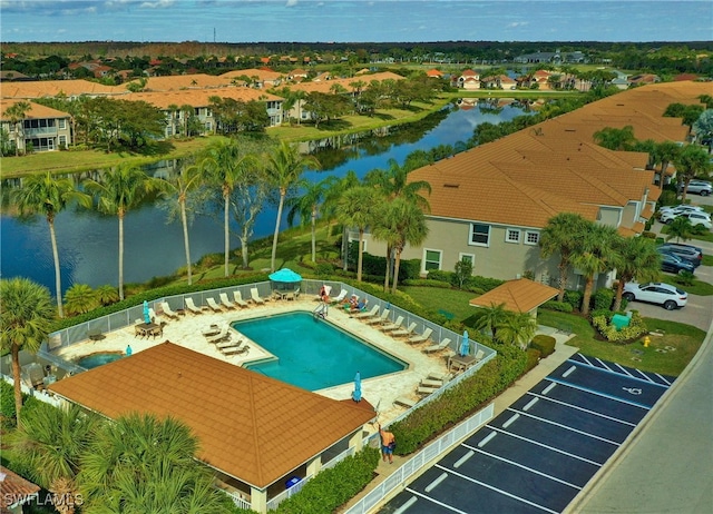 view of pool with a water view