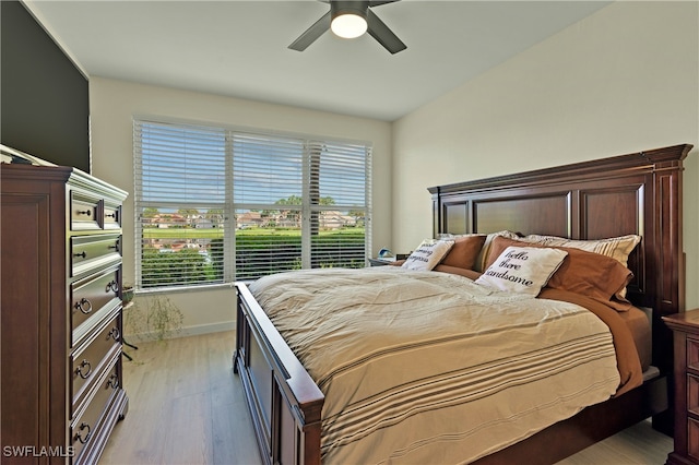 bedroom featuring ceiling fan and light hardwood / wood-style flooring