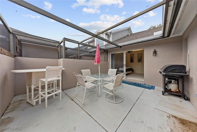 view of patio / terrace featuring a lanai and area for grilling