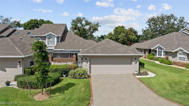 view of front of home featuring a front yard and a garage