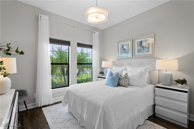 bedroom featuring dark wood-type flooring