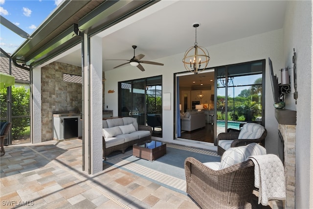 view of patio featuring a lanai and ceiling fan