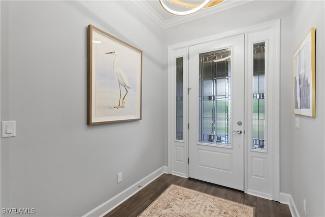 foyer entrance featuring dark wood-type flooring and ornamental molding