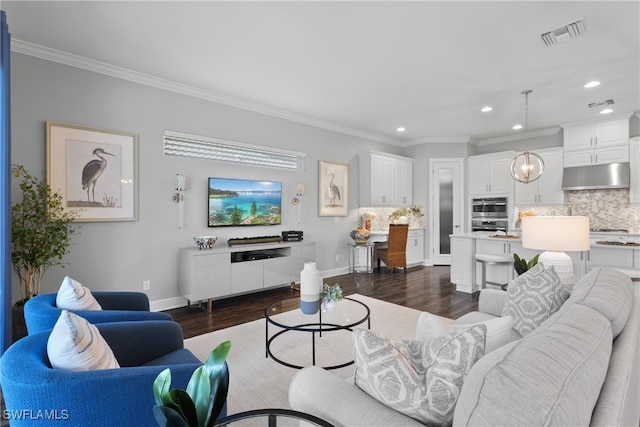 living room featuring ornamental molding and dark wood-type flooring