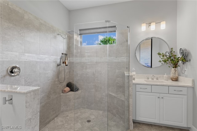 bathroom featuring vanity and a tile shower