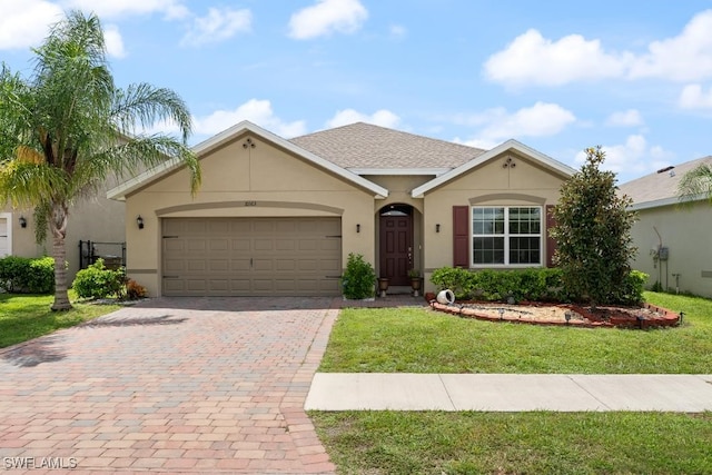 ranch-style home featuring a front yard and a garage